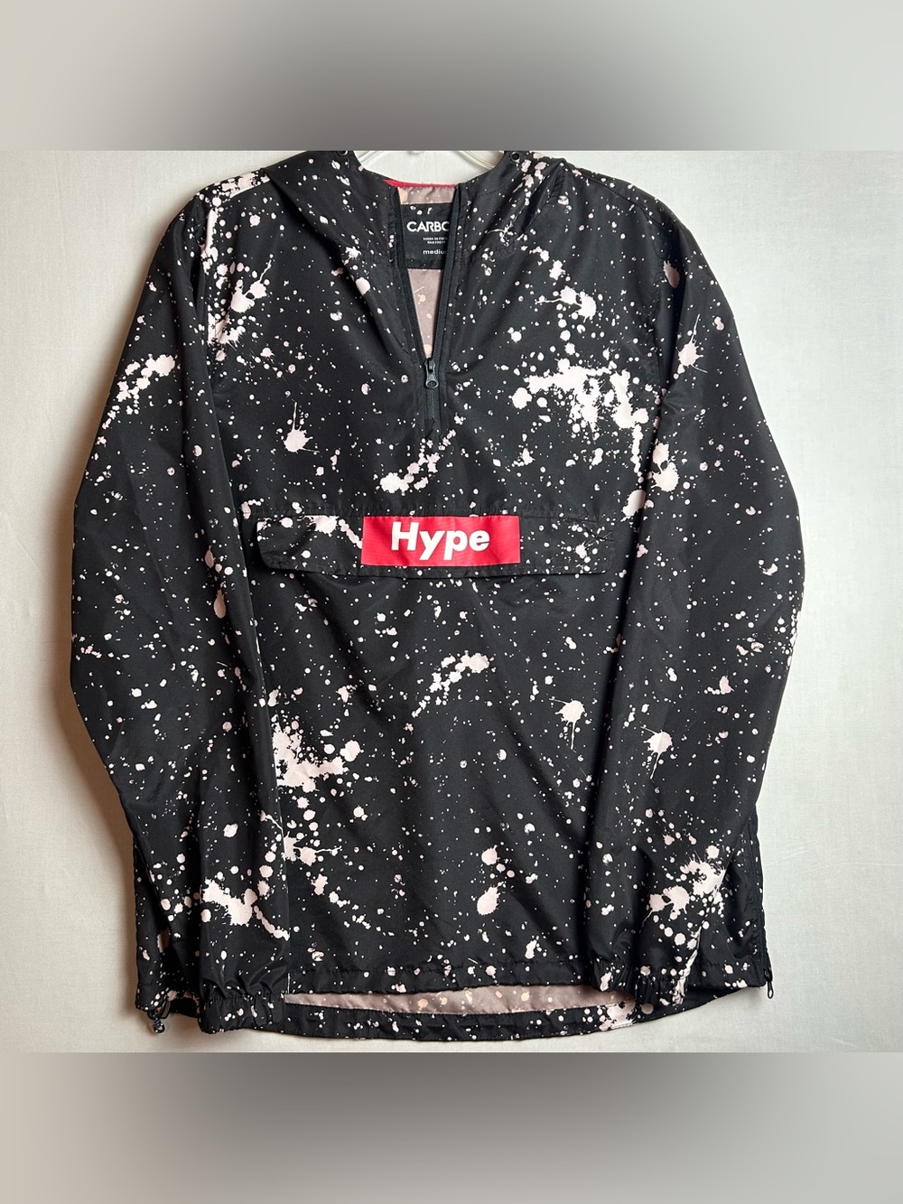 Carbon Black Jacket Label with Pink Splatter Detail